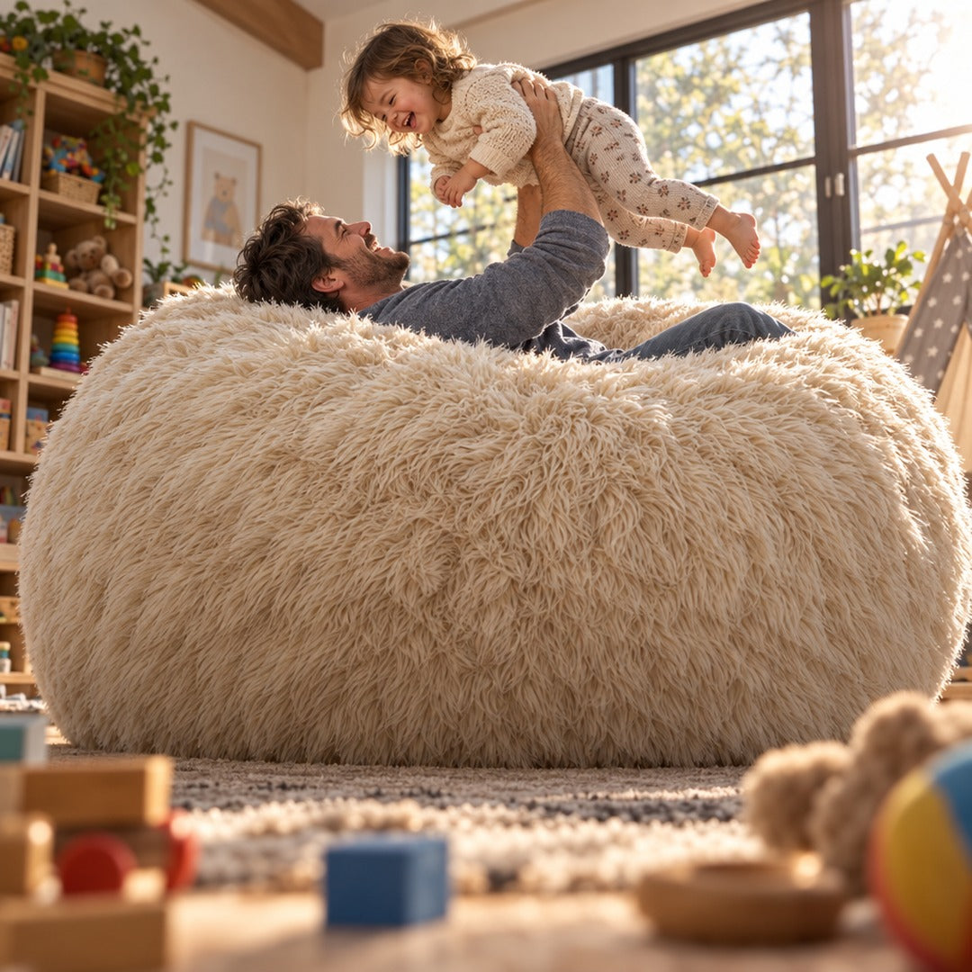 A father lifting a toddler above the bean bag in a playroom