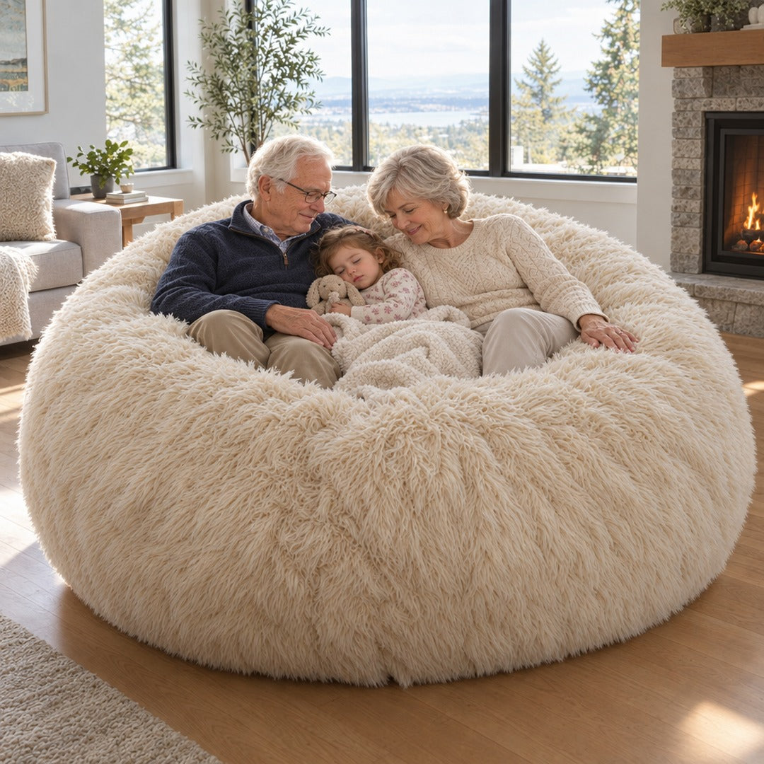 Grandparents and a grandchild relaxing on the bean bag by a fireplace