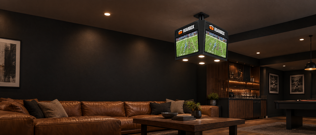 The unit above a lounge seating area with football on the screens