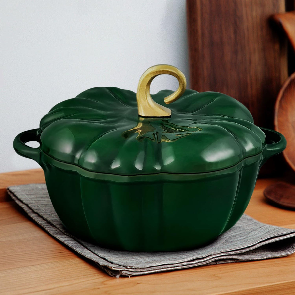 Green pumpkin Dutch oven on a kitchen counter