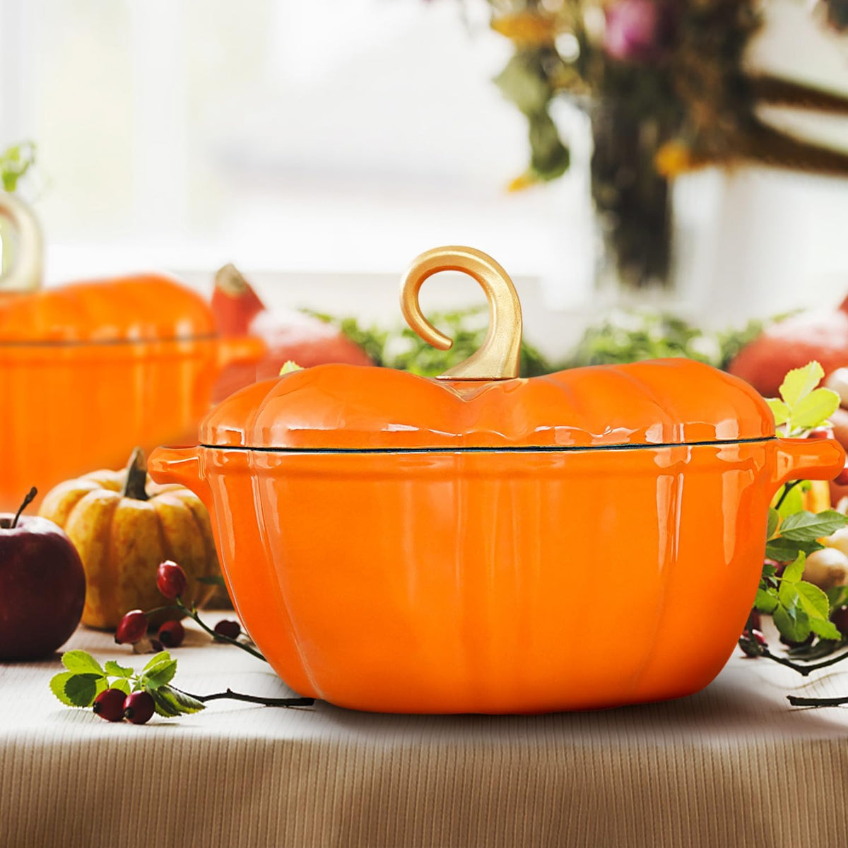 Orange pumpkin Dutch oven on a harvest table