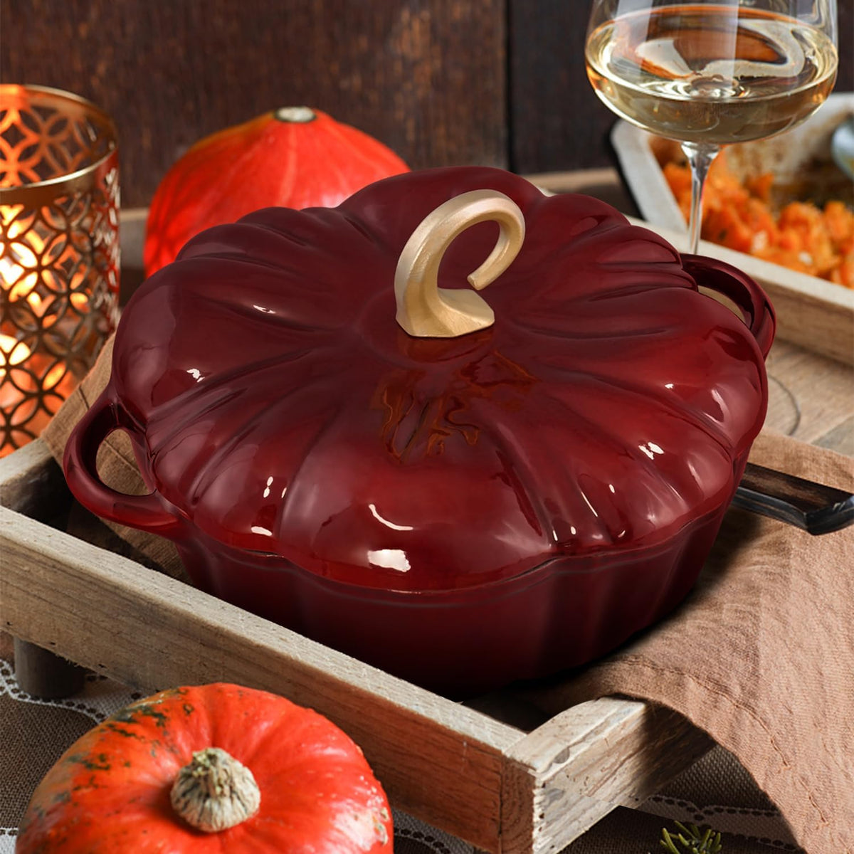 Red pumpkin Dutch oven on a wooden tray