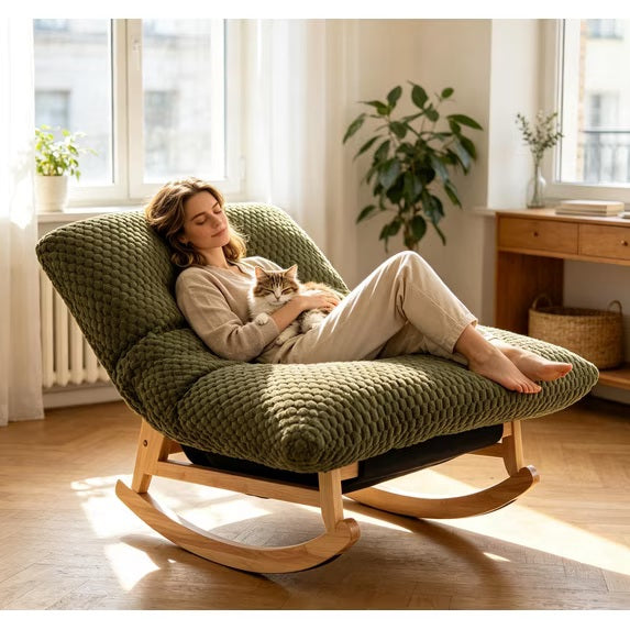 The papasan rocking chair in Army Green, with someone resting in it beside a cat